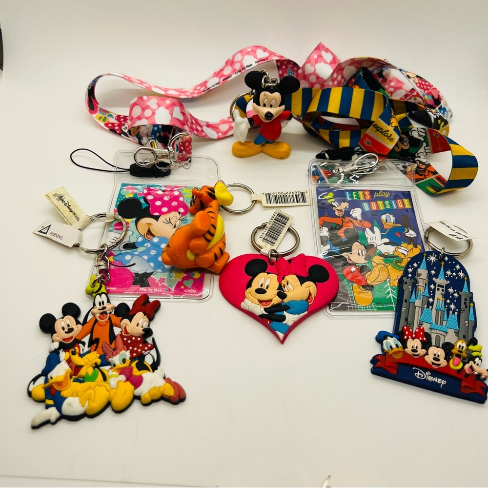 NWT Disney Bundle with two laminated and 7 figurines/keychains